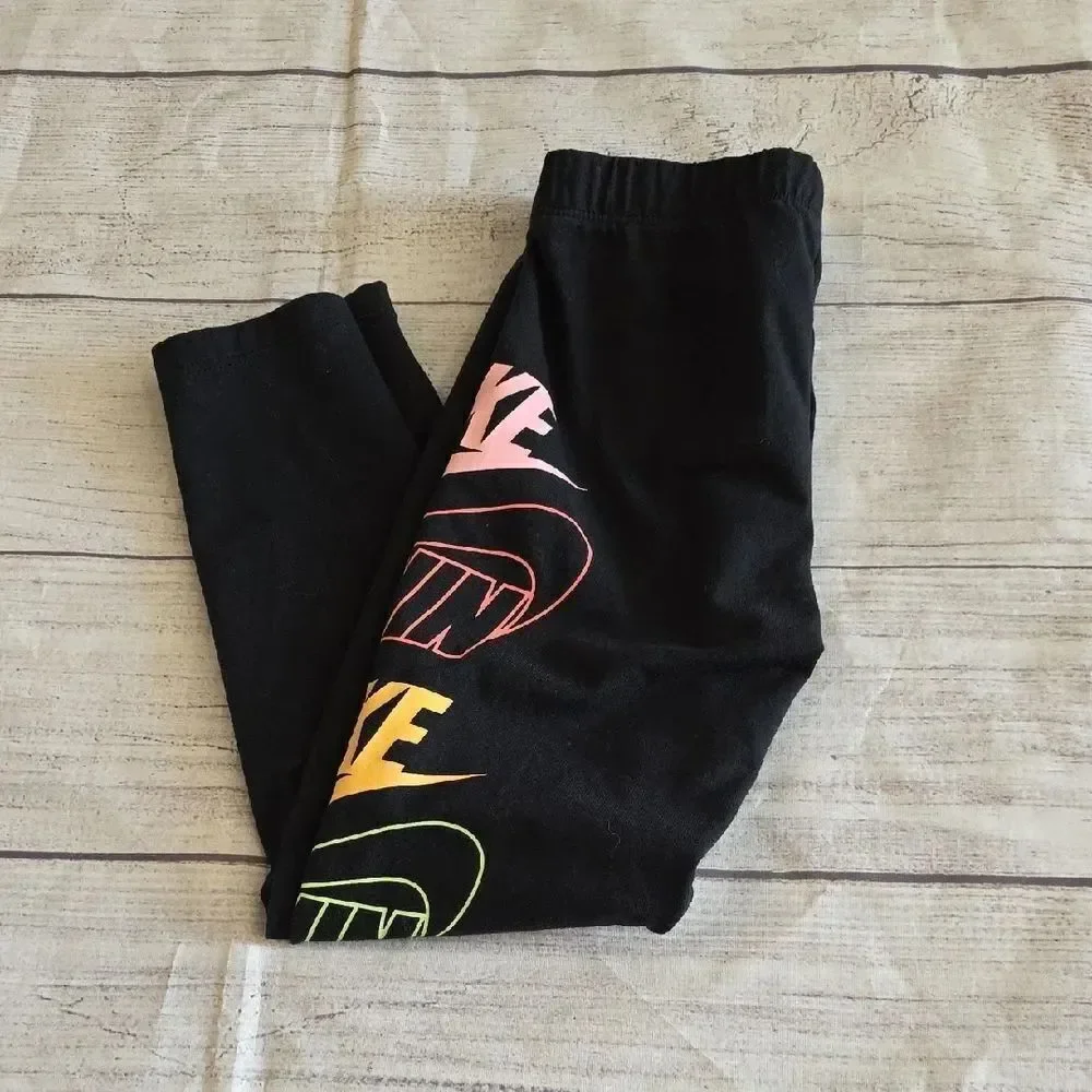 Nike Black and Pink Leggings with Bold Logo Design